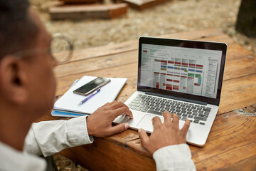 Young african american man working on laptop