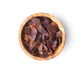 Sliced beef jerky in bowl. Dried beef meat.