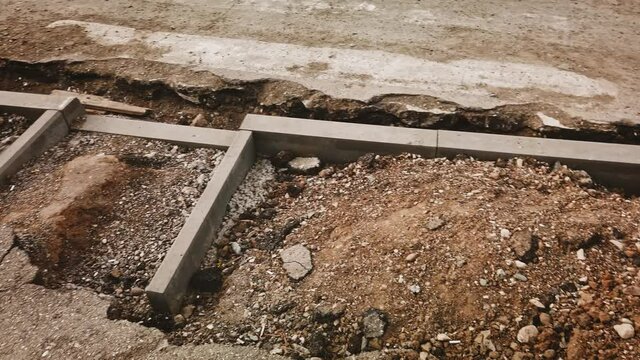 Pedestrian crossing reconstruction with new cyrbstones installed and borderless for disabled people.