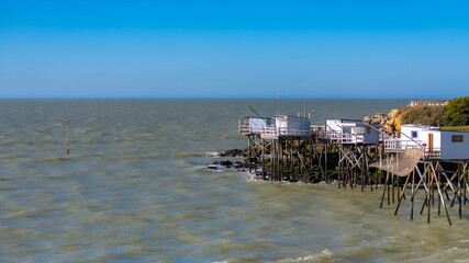 Royan in France, typical huts on stilts on the coast
