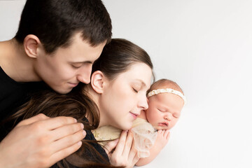 Fototapeta premium family portrait. mother and father with newborn baby. mom, dad and kids