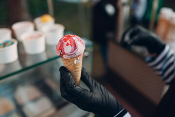 Topping heart shape on cone frozen yogurt or ice cream