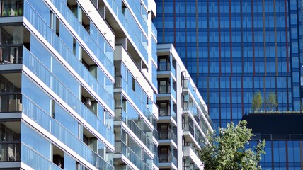 A residential building and an adjacent office building. Modern urban development.