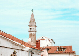 Sunny summer view of St. George's Parish Church in Piran town. Beautiful cityscape of Slovenia,...