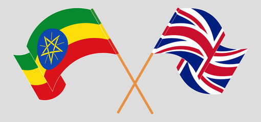 Crossed and waving flags of Ethiopia and the UK