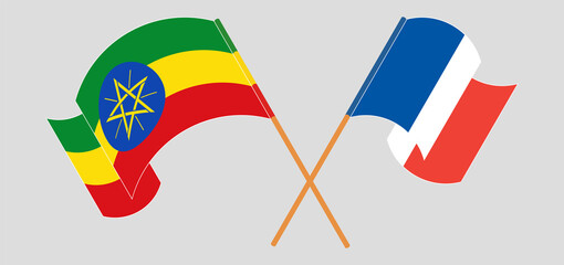 Crossed and waving flags of Ethiopia and France