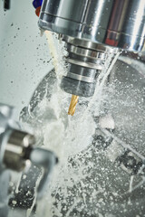 CNC milling machine work. metal processing with coolant