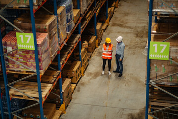 Supervisor and employee working together in a warehouse