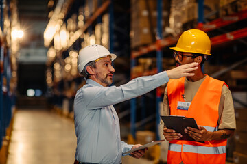 Warehouse staff meeting, worker with manger