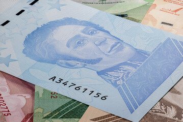 Close up to the currency of the south American country Venezuela. High inflation and weak economy increases the denomination of the banknotes. Bolivares or Bolivar money of the republic Venezuela 