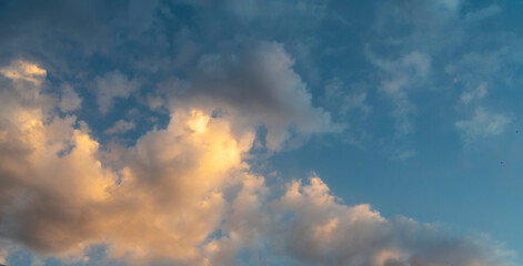 Fototapeta premium Amazing summer sky with beautiful orange clouds after sunset. Sky background.