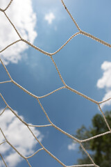 soccer goal net against blue sky
