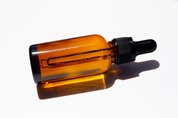 Brown bottle eye dropper on white background.