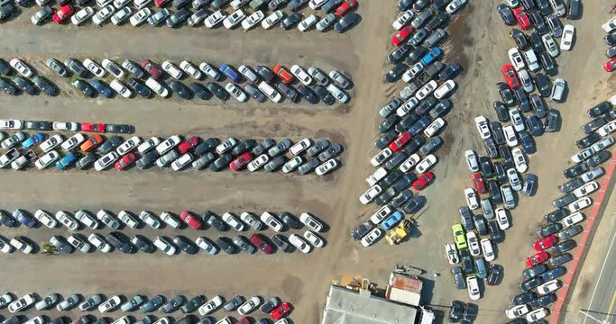 Aerial top down view of auction distribution center cars parked in car parking lot