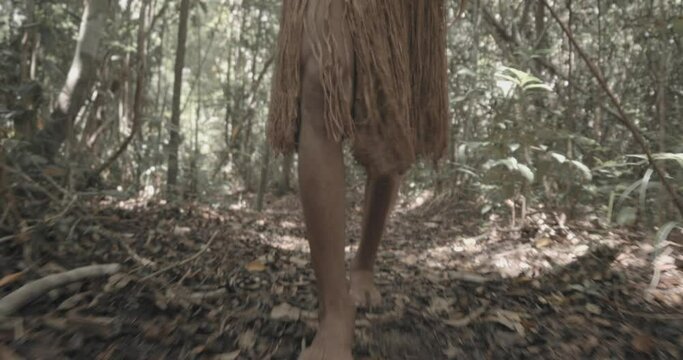 Leg view from "Patax&oacute;" Indian, run through the forest. Brazilian Indian. 4K.