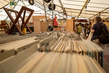 Selective focus at selected second hand old fashion phonograph discs  in the paper box at the stall in flee market in Düsseldorf, Germany.  