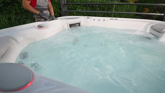 SPA Hot Tub Technician Performing Scheduled Maintenance