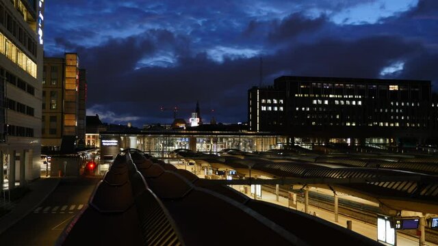 Oslo Bj&oslash;rvika Norway - Timelapse evening of Dronning Eufemias Gate with dark and fast moving clouds and city lights and rainbow flag - Date taken: june 25 2021