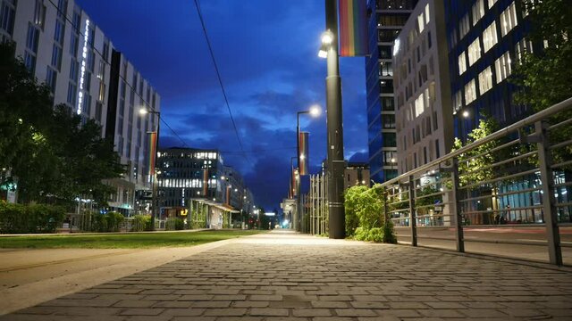 Oslo Bj&oslash;rvika Norway - Timelapse evening of Dronning Eufemias Gate with dark and fast moving clouds and city lights and rainbow flag - Date taken: june 25 2021