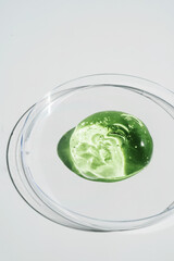 Green gel texture of a cosmetic care product.