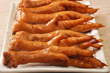 Marinated chicken feet on a plate