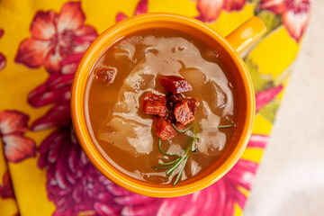 onion soup bowl top view with bacon and floral backgrounds 