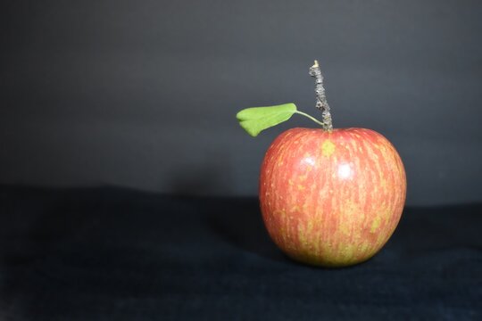 red apple on a black background