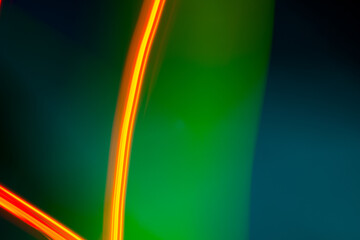 neon light motion on black. colorful abstract light background. shining light for decorating design as background and overlay to beautify a creative project.