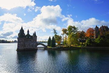 Historic Boldt Castle on Heart Island. Tree, leaves, river, blue sky.