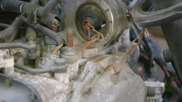 Rusted hulk wreck of radiator car machine engine partially, old metal abandoned car