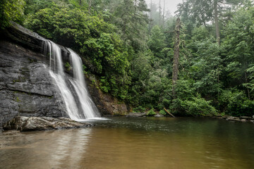 Silver Run Falls, a beautiful waterfall in Nantahala National Forest near the town of Cashiers in the North Carolina mountains, plunges into a swimming hole at its base.