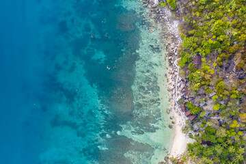 Clean Clear Blue Ocean Sea Water with rocks beach no people copy space paradise tropical island beautiful Koh Tao Thailand drone ariel aerial uav