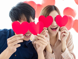 Excited Asian couple with heart shaped eyes