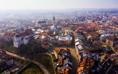 View from drone of historic center of Lublin with Old Church Square and Dominican monastery on background with Catholic Archcathedral and Trinitarian Tower at springtime, Poland © JackF