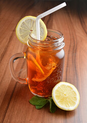 chilled cold lemon fruit ice tea kombucha and mint leaf on wood table cocktail beverage menu