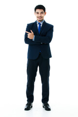 Portrait of cheerful young Asian businessman pointing finger to the side blank space isolated on white background. Studio shot, business and success concept.