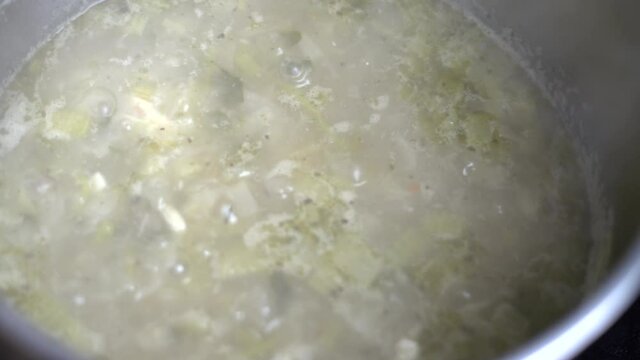 Green Vegetable Soup Boiling In Metal Pot. Making Stockpot. Organic Plant Based Raw Vegan Food. Green Fresh Salad Recipes. Veg Soup Being Cooked. Healthy Vegetarian Foods.