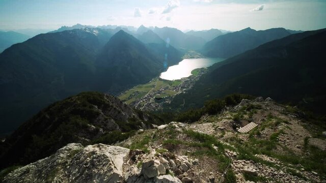 Black bird taking off. Alpine chough flying over big mountain peaks in Austria, Tyrol, next to the lake of Achen. At the top of Ebner Joch.