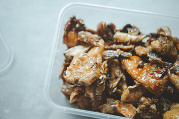 Close up of Dried squid with spicy and sweet sauce