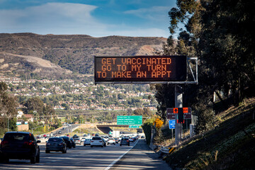 Electronic Traffic Sign with message about getting vaccinated against COVID-19
