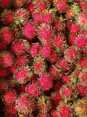 Pile of ripe rambutan local thailand fruits background
