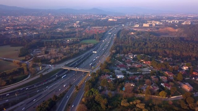 Panorama Of Moderate Traffic At AP-7 Toll Motorway In Sant Cugat del Valles, Barcelona, Spain. aerial