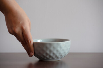 Serving food in a ceramic bowl of grey color