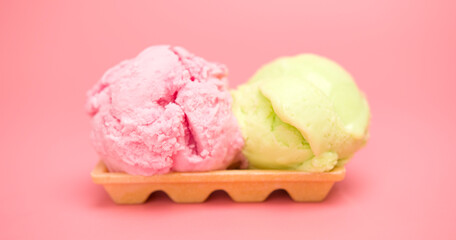 ice cream strawberry and ice cream lemon-lime on top Waffles isolated on the pink background.