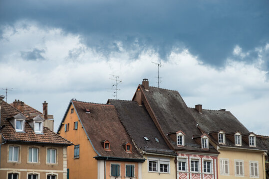 Closeup of medeval architecture on stormy sky background in mulhouse - France