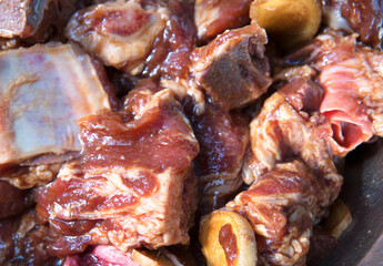Fresh spare ribs marinated in a basin