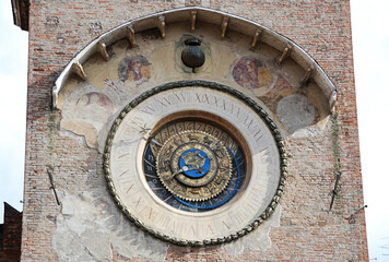 Big  tower clock in Piazza delle Erbe. Mantova. Italy