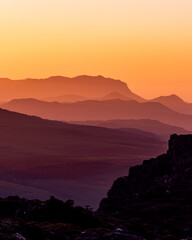sunset in the mountains, layers of light and colour, Tasmania, Australia.