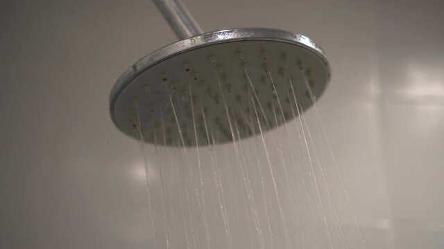 Footage B roll of Turning on and off the shower. Shower time in the bathroom.