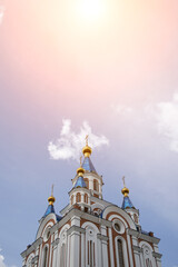 Fototapeta na wymiar View of the golden domes of the Orthodox Church against the sky
